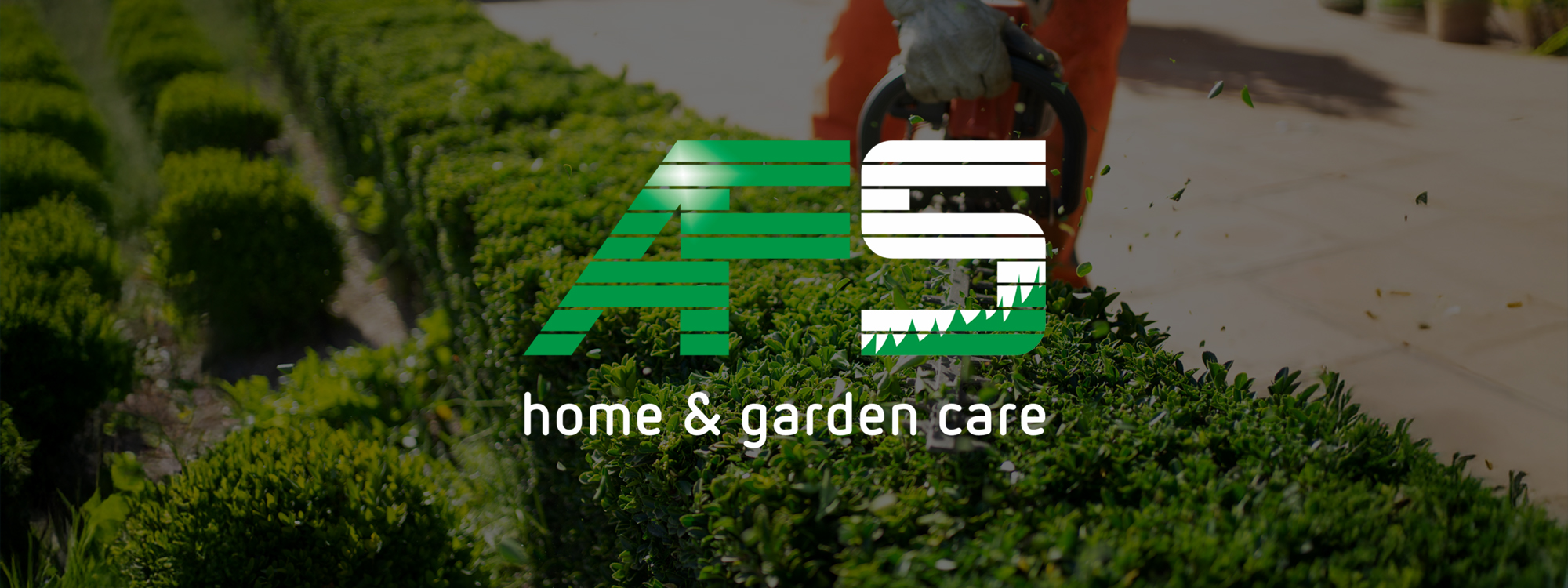 Home and garden care specialists. Hedge trimming in action. Shrub pruning. Gardening.